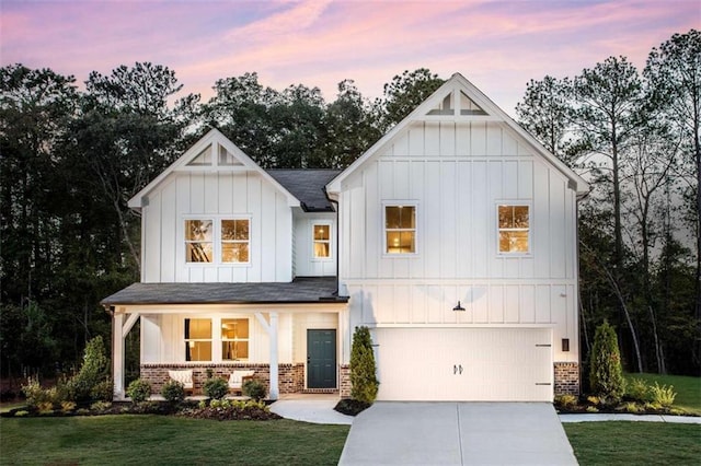 129 Henley St, Canton, GA 30114 - modern farmhouse style home with board and batten siding, brick siding, concrete driveway, and a garage