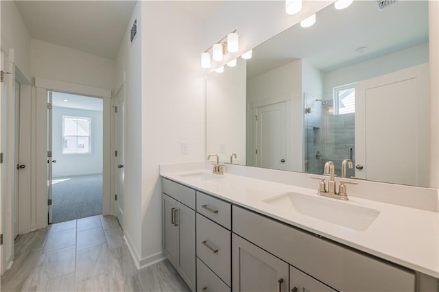 129 Henley St, Canton, GA 30114 - bathroom with double vanity, a shower stall, and marble look tile flooring