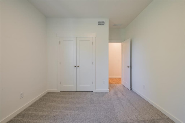 129 Henley St, Canton, GA 30114 - unfurnished bedroom with carpet and a closet