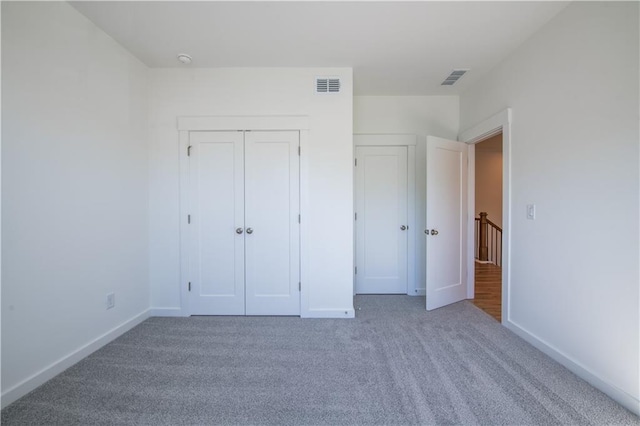 129 Henley St, Canton, GA 30114 - unfurnished bedroom with carpet floors and a closet