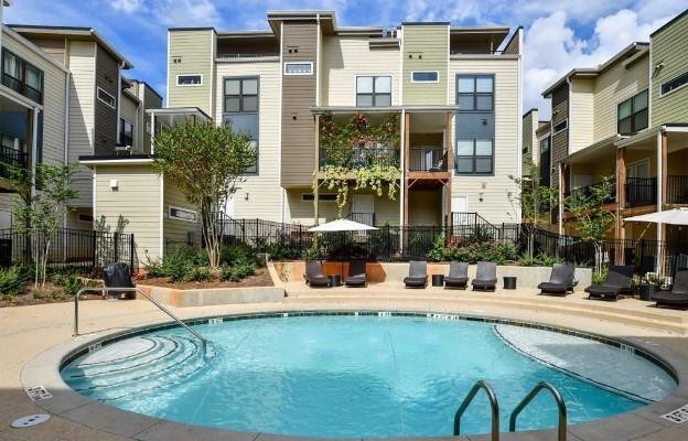 view of pool with a patio and fence