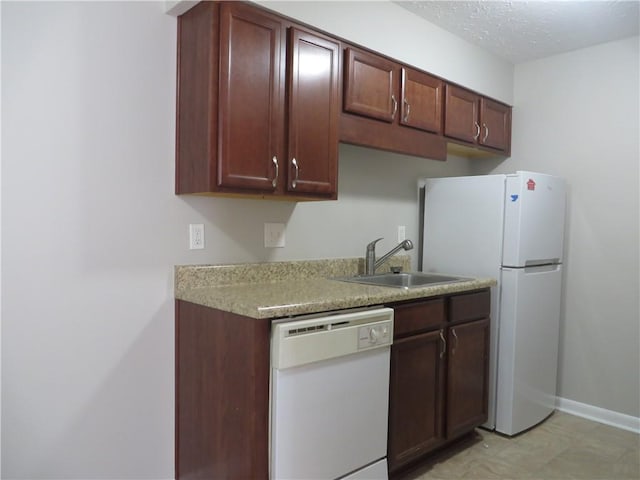 kitchen with white appliances and sink