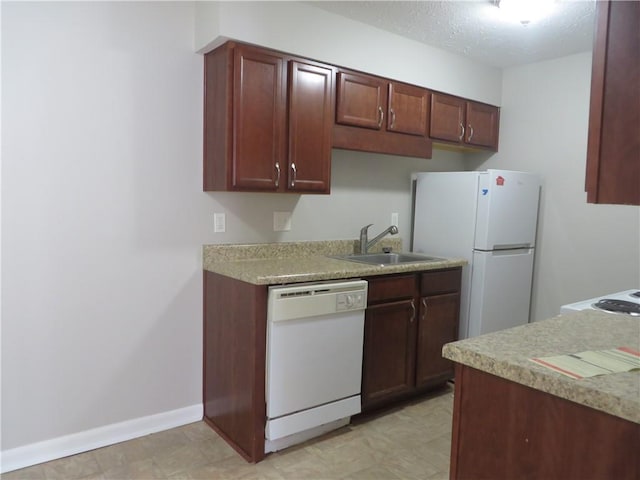 kitchen with white appliances and sink