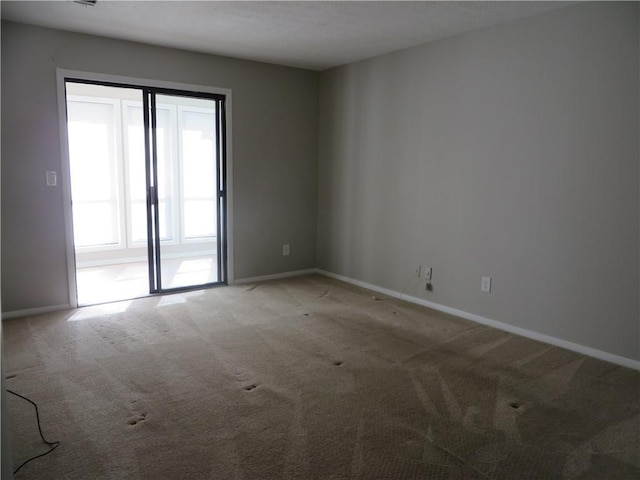 view of carpeted spare room