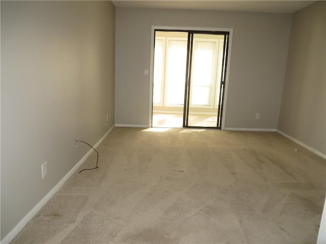 empty room with light colored carpet