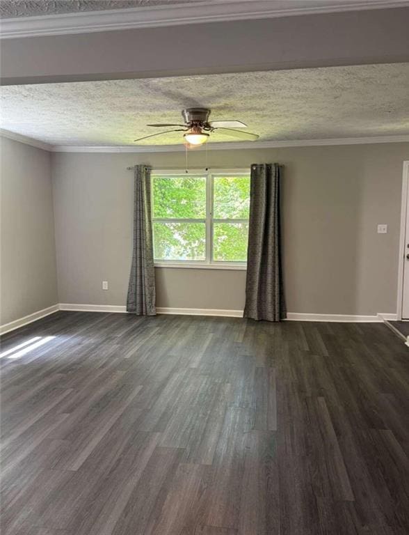 spare room with ceiling fan, a textured ceiling, dark hardwood / wood-style flooring, and ornamental molding