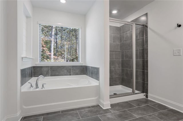 bathroom with tile patterned floors and plus walk in shower