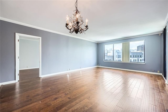 3481 Lakeside Dr NE Unit 1107, Atlanta, GA 30326 - empty room featuring a chandelier, wood finished floors, ornamental molding, and baseboards