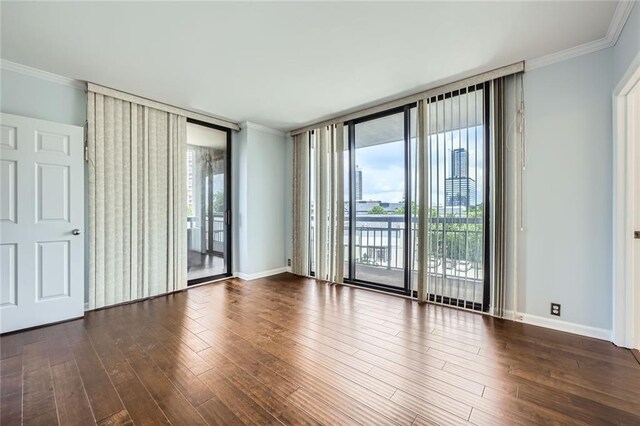 3481 Lakeside Dr NE Unit 1107, Atlanta, GA 30326 - empty room with floor to ceiling windows, ornamental molding, wood finished floors, and baseboards
