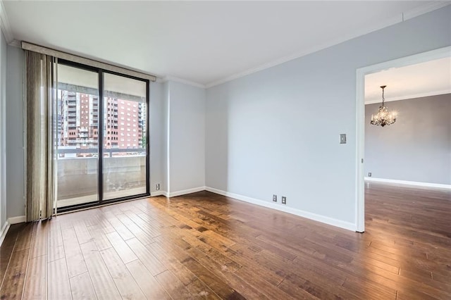 3481 Lakeside Dr NE Unit 1107, Atlanta, GA 30326 - empty room with a chandelier, crown molding, dark wood finished floors, baseboards, and floor to ceiling windows