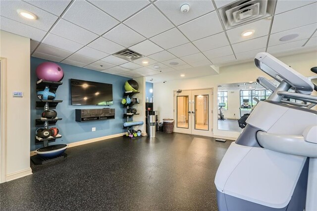 3481 Lakeside Dr NE Unit 1107, Atlanta, GA 30326 - workout area featuring baseboards, a paneled ceiling, and french doors