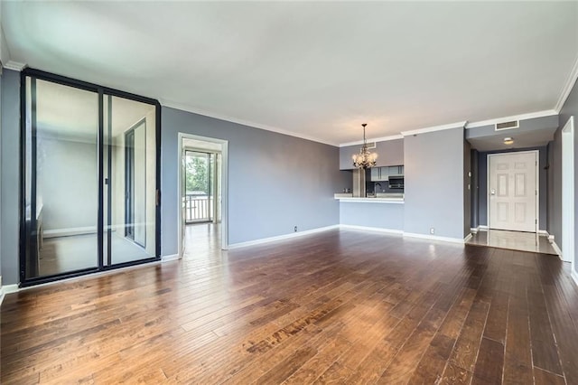3481 Lakeside Dr NE Unit 1107, Atlanta, GA 30326 - unfurnished living room with a chandelier, dark wood-style floors, baseboards, and crown molding