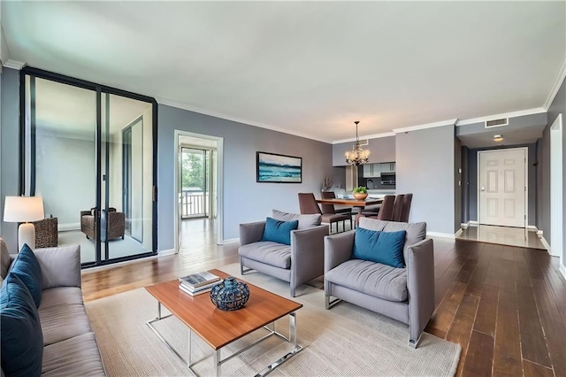 3481 Lakeside Dr NE Unit 1107, Atlanta, GA 30326 - living area with a chandelier, hardwood / wood-style flooring, crown molding, and baseboards