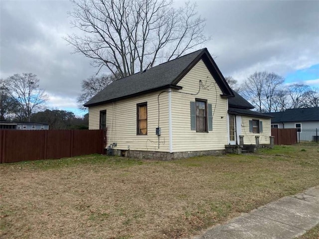 view of property exterior featuring a lawn