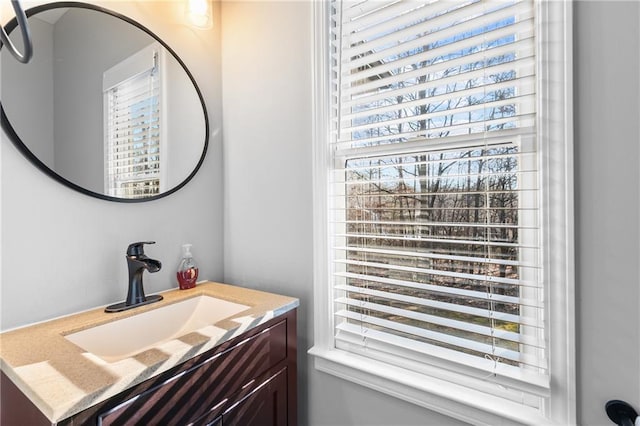 bathroom with vanity and plenty of natural light