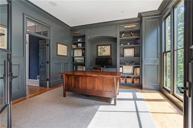 6515 Ashbourne Ct, Suwanee, GA 30024 - office space featuring built in features, plenty of natural light, a decorative wall, ornamental molding, and wood finished floors