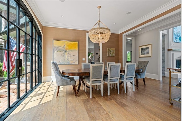 6515 Ashbourne Ct, Suwanee, GA 30024 - dining room featuring a chandelier, light wood-style flooring, baseboards, ornamental molding, and recessed lighting