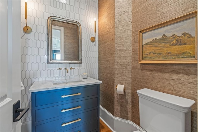 6515 Ashbourne Ct, Suwanee, GA 30024 - bathroom with toilet, wallpapered walls, and vanity