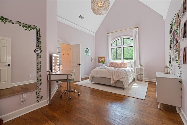 6515 Ashbourne Ct, Suwanee, GA 30024 - bedroom featuring high vaulted ceiling, baseboards, wood finished floors, and crown molding
