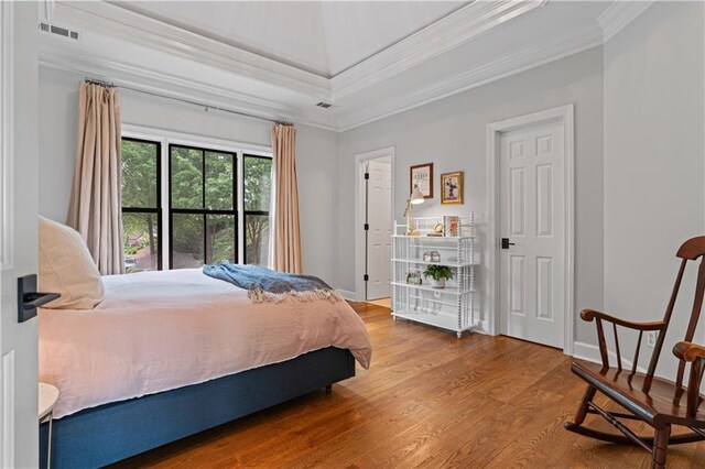 6515 Ashbourne Ct, Suwanee, GA 30024 - bedroom with ornamental molding, wood finished floors, and baseboards