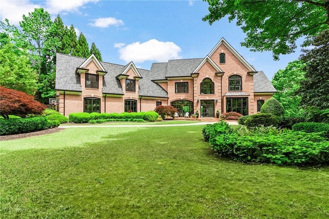 6515 Ashbourne Ct, Suwanee, GA 30024 - view of front of house featuring a front yard and brick siding