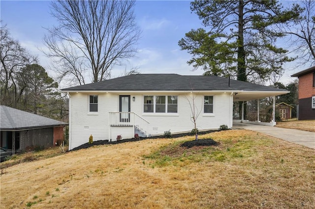 view of front facade with brick siding, driveway, crawl space, a carport, and a front lawn