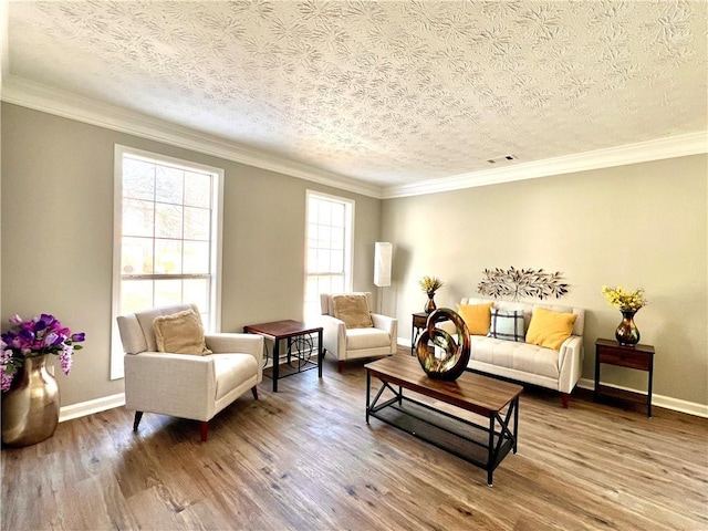 living room featuring ornamental molding, hardwood / wood-style floors, and a textured ceiling