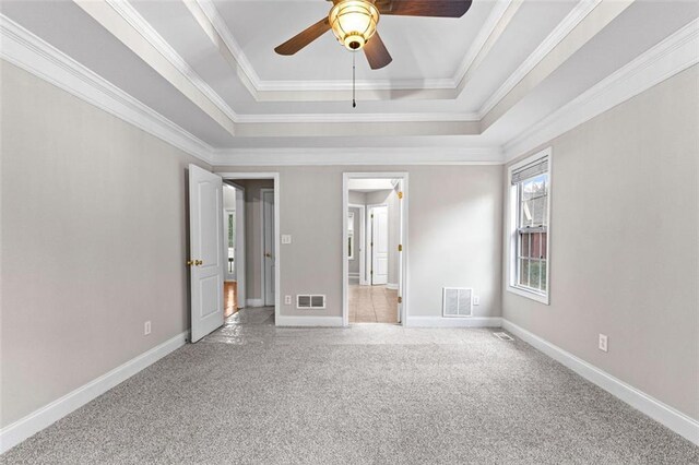 2443 High Meadows Ct, Conyers, GA 30094 - carpeted spare room with baseboards, ceiling fan, visible vents, and a raised ceiling
