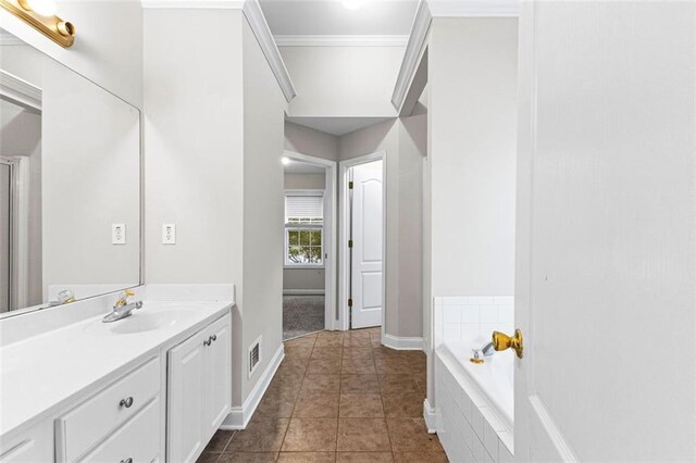 2443 High Meadows Ct, Conyers, GA 30094 - full bathroom featuring tile patterned floors, crown molding, vanity, a bath, and visible vents