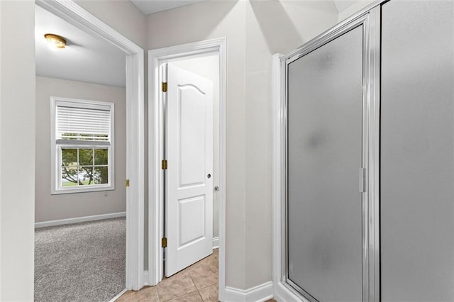2443 High Meadows Ct, Conyers, GA 30094 - full bath featuring tile patterned floors, baseboards, and a shower stall