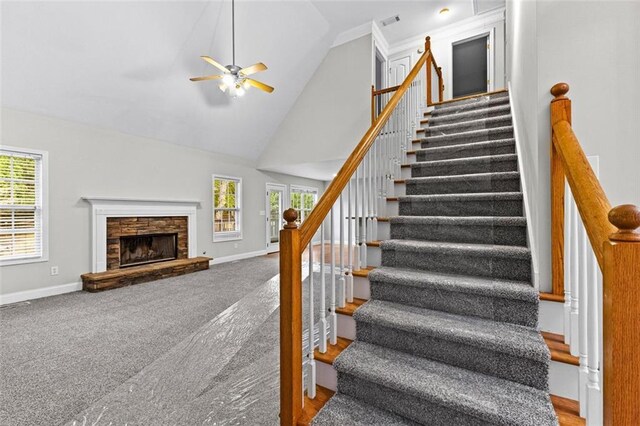 2443 High Meadows Ct, Conyers, GA 30094 - stairs featuring baseboards, ceiling fan, high vaulted ceiling, and a fireplace