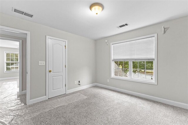 2443 High Meadows Ct, Conyers, GA 30094 - carpeted empty room with baseboards and visible vents