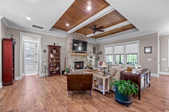 131 Quiet Cove Way, Monticello, GA 31064 - living area with wooden ceiling, ceiling fan, baseboards, a large fireplace, and wood finished floors