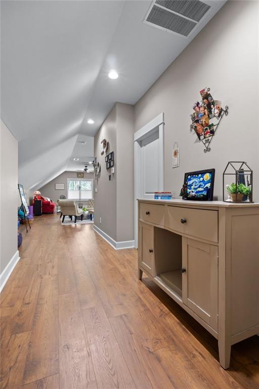 131 Quiet Cove Way, Monticello, GA 31064 - office featuring vaulted ceiling, light wood finished floors, recessed lighting, and baseboards