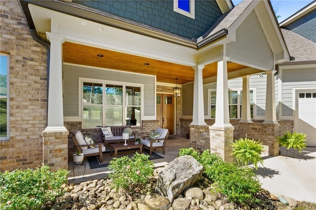 131 Quiet Cove Way, Monticello, GA 31064 - covered porch with a garage, an outdoor hangout area, and driveway