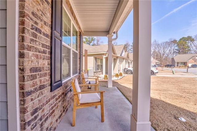 view of patio / terrace featuring a residential view and a porch