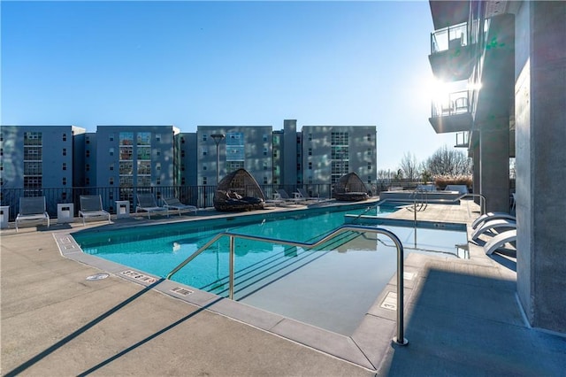 view of swimming pool with a patio area