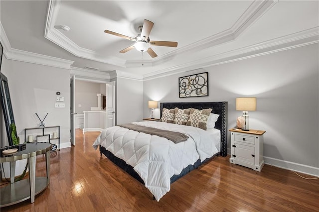 2873 Overlook Way NE, Atlanta, GA 30324 - bedroom featuring a tray ceiling, crown molding, wood finished floors, and ceiling fan