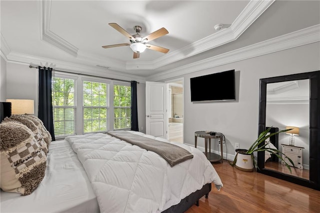 2873 Overlook Way NE, Atlanta, GA 30324 - bedroom featuring crown molding, a raised ceiling, wood finished floors, a ceiling fan, and connected bathroom
