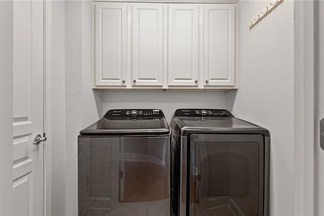 2873 Overlook Way NE, Atlanta, GA 30324 - washroom featuring independent washer and dryer and cabinet space