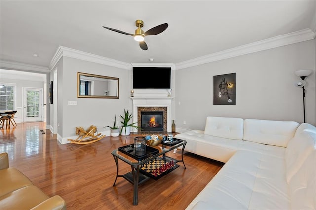 2873 Overlook Way NE, Atlanta, GA 30324 - living area with crown molding, ceiling fan, wood finished floors, and a fireplace