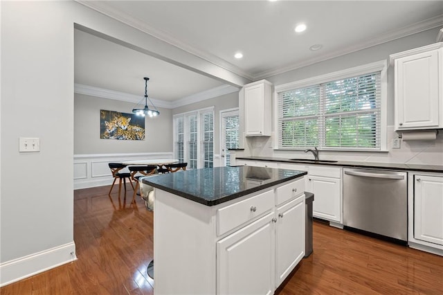 2873 Overlook Way NE, Atlanta, GA 30324 - kitchen featuring stainless steel dishwasher, ornamental molding, white cabinetry, dark wood finished floors, and a kitchen island