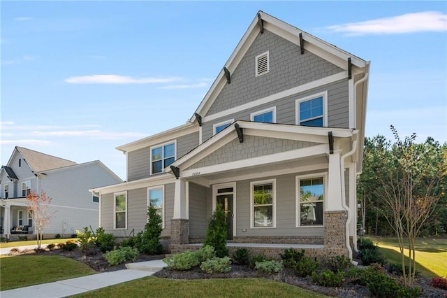 craftsman-style house with a front yard