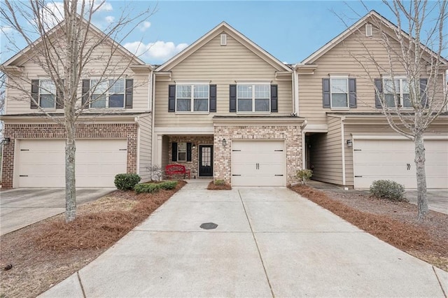 2785 Maple Park Pl, Cumming, GA 30041 - townhome / multi-family property featuring a garage, driveway, and brick siding
