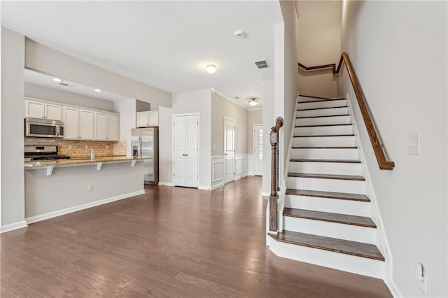 2785 Maple Park Pl, Cumming, GA 30041 - interior space featuring stairway, dark wood-style flooring, visible vents, and baseboards