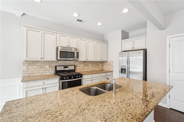 2785 Maple Park Pl, Cumming, GA 30041 - kitchen with tasteful backsplash, visible vents, appliances with stainless steel finishes, white cabinetry, and a sink