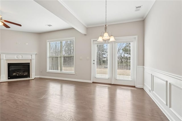2785 Maple Park Pl, Cumming, GA 30041 - unfurnished dining area featuring visible vents, a glass covered fireplace, dark wood-style flooring, and beamed ceiling