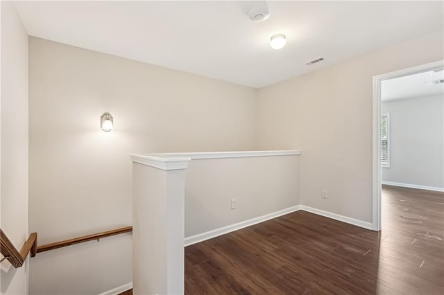 2785 Maple Park Pl, Cumming, GA 30041 - spare room with wood finished floors, visible vents, and baseboards