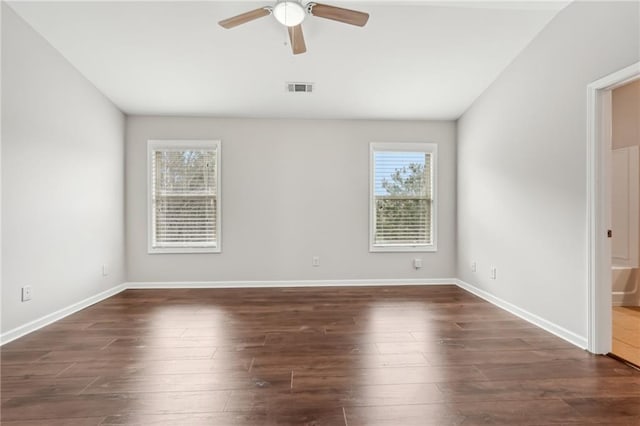 2785 Maple Park Pl, Cumming, GA 30041 - spare room featuring a ceiling fan, baseboards, visible vents, and dark wood-style flooring