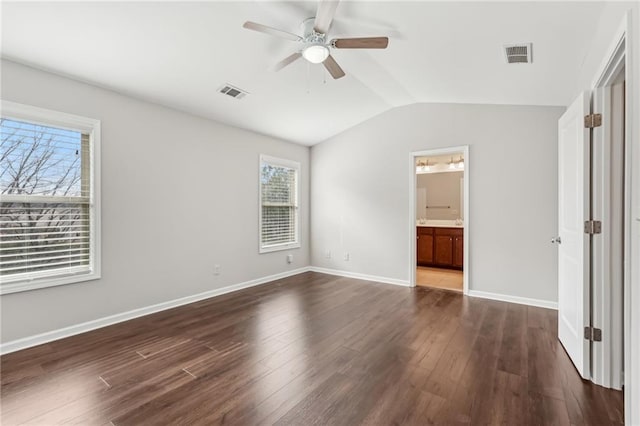 2785 Maple Park Pl, Cumming, GA 30041 - unfurnished bedroom with dark wood-style floors, baseboards, visible vents, and vaulted ceiling